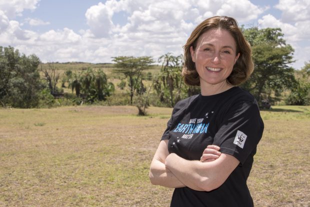 Picture of Tanya wearing a WWF t-shirt and standing ing the field