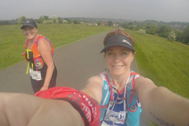 Selfie picture of Helen and a friend running