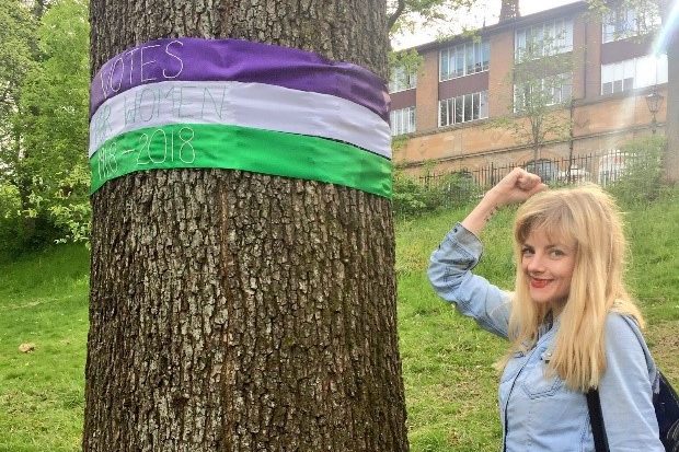 Vicky with the Suffragette Oak in Kelvingrove Park, Glasgow. The tree was planted by suffrage organisations 1918 to commemorate women being granted the right to vote in February of that year.